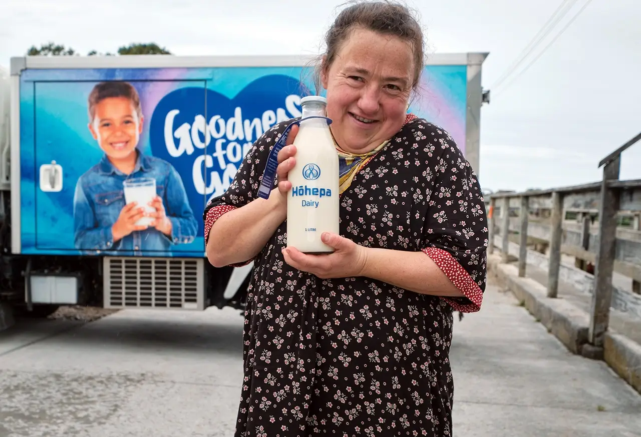 Teresa enjoys refilling milk bottles at our Clive bio-dynamic farm